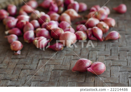 Two shallots on blurred shallots background. 22214486