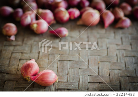 Two shallots on blurred shallots. 22214488