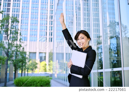Hands up lifting hands in working female suit and hands it with d Hands up lifting hands in working female suit and hands it with d 22217081