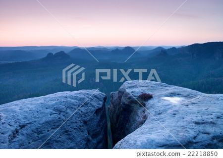 Morning view over sandstone cliff in forest valley Morning view over sandstone cliff in forest valley 22218850