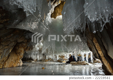 Multicolored stone grotto with icicles. Multicolored stone grotto with icicles. 22219581
