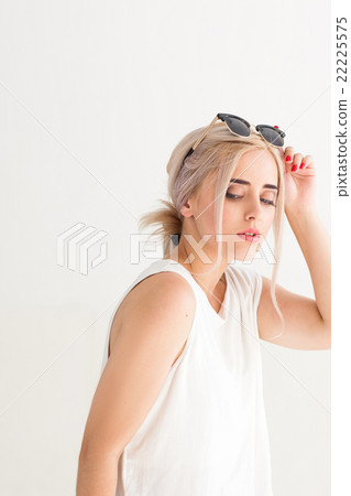 Woman with black sunglasses on head 22225575