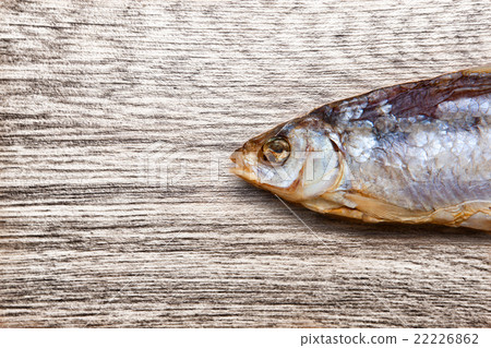Dry fish on a wooden background Dry fish on a wooden background 22226862