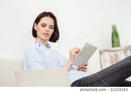 Cheerful woman is using computer for study 22229283