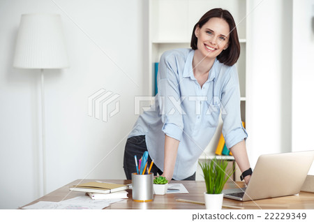 Attractive girl is using computer for work Attractive girl is using computer for work 22229349