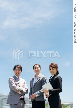 Smiling instructors lined up with the school in the background (education/business image) Smiling instructors lined up with the school in the background (education/business image) 22230517