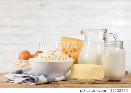 Milk jar on wooden table Milk jar on wooden table 22232553