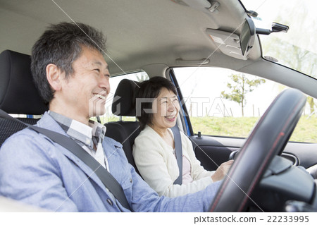 A couple in their 50s enjoying driving A couple in their 50s enjoying driving 22233995