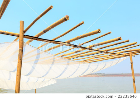 wooden with fabric roof on blue sky 22235646