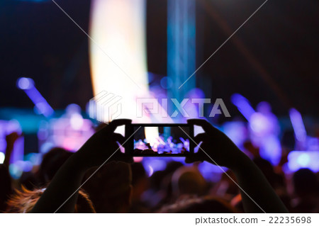 Take photo concert in front of stage 22235698