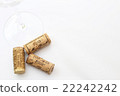 Wineglass and cork left edge bouncing white back advertising space Wineglass and cork left edge bouncing white back advertising space 22242242