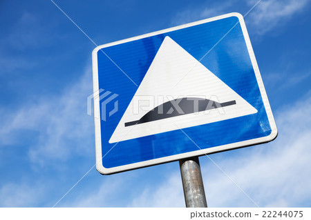 Speed Bump. Square road sign over cloudy sky Speed Bump. Square road sign over cloudy sky 22244075