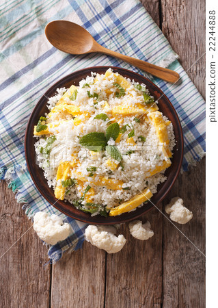 Cauliflower rice with scrambled eggs and herbs 22244888