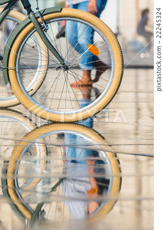 People riding bicycles in the mirror fountain People riding bicycles in the mirror fountain 22245324