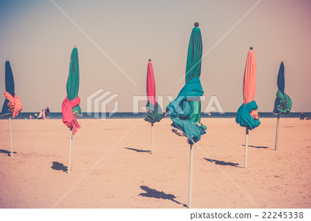 The famous colorful parasols on Deauville beach The famous colorful parasols on Deauville beach 22245338