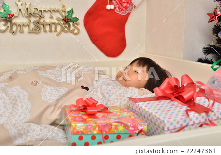 A girl waiting for a Christmas gift (bedroom) 22247361