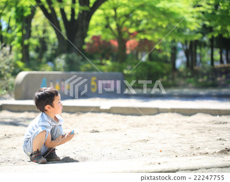 Infant playing sandbox 22247755