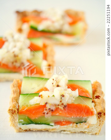 Quiche cut version of cucumber and smoked salmon (up) 22251194
