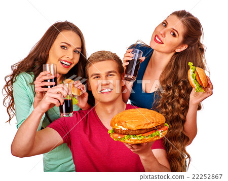 Man and women eating big sandwich with cola 22252867