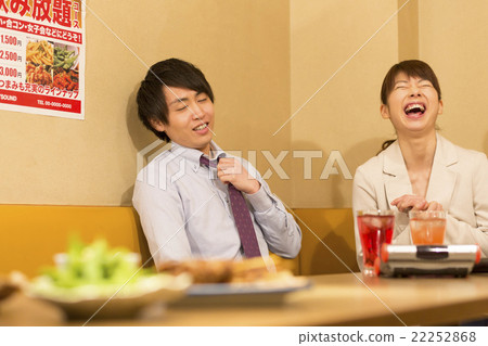 A man and a woman in a pub 22252868