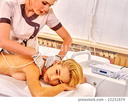 Woman receiving electricity gloves massage at 22252874