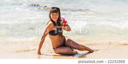 Beautiful woman relaxing on a paradise beach. Beautiful woman relaxing on a paradise beach. 22252988