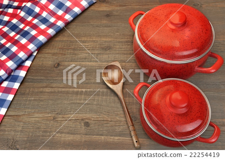 Two Covered Red Saucepan, Tablecloth And Spoon Two Covered Red Saucepan, Tablecloth And Spoon 22254419