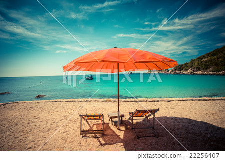 Beach chair with umbrella in seashore 22256407