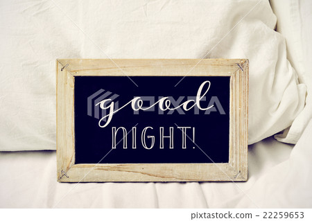 text good night in a chalkboard on a bed 22259653