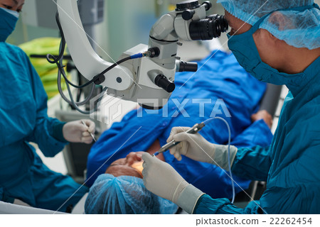 Performing surgery Performing surgery 22262454