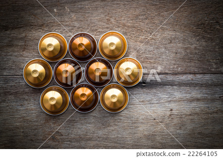 Nespresso capsule on wooden background. 22264105