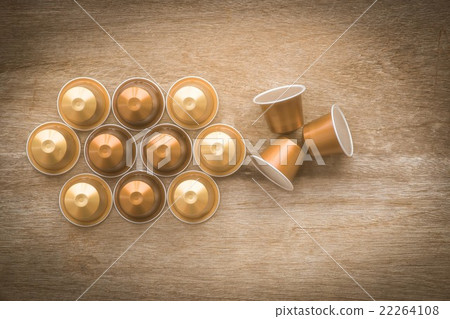Nespresso capsule on wooden background. 22264108