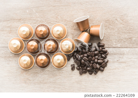 Nespresso and coffee beans on wooden background. Nespresso and coffee beans on wooden background. 22264109