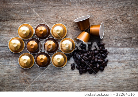 Nespresso and coffee beans on wooden background. 22264110