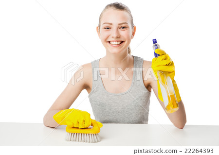 Young woman with scrub brush and cleansing spray Young woman with scrub brush and cleansing spray 22264393