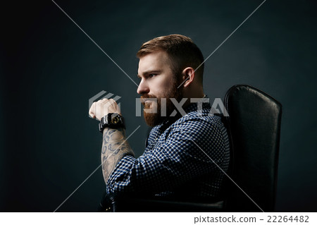 Thoughtful red bearded man studio portrait on dark Thoughtful red bearded man studio portrait on dark 22264482