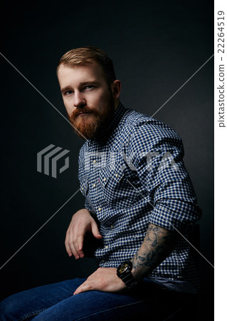 Thoughtful red bearded man studio portrait on dark Thoughtful red bearded man studio portrait on dark 22264519