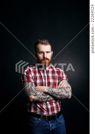 Red bearded man with tattoes studio portrait on Red bearded man with tattoes studio portrait on 22264524