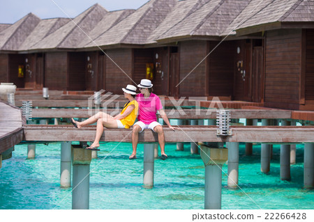 Young couple on beach jetty at tropical island in 22266428
