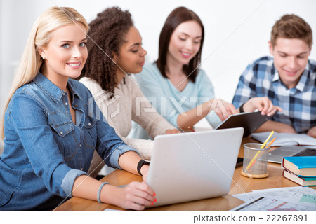 Cheerful students studying in the circle 22267891