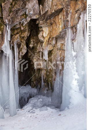 Cave in the rock with icicles. 22270550