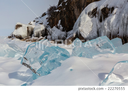 Transparent icicles in the snow on a background of Transparent icicles in the snow on a background of 22270555