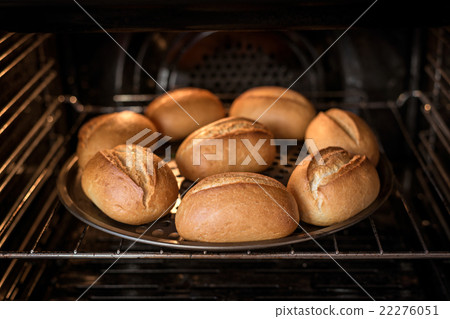 Home baked bread in oven Home baked bread in oven 22276051
