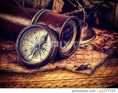 Old vintage compass on ancient map 22277724