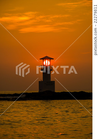 Silhouettes of lighthouse at sunset. 22279811