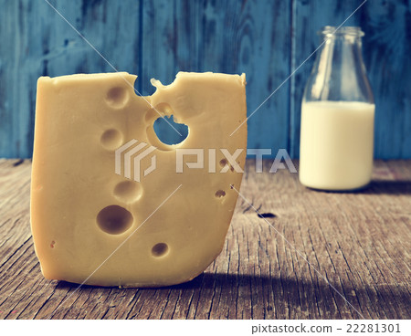 cheese and milk on a rustic wooden table cheese and milk on a rustic wooden table 22281301