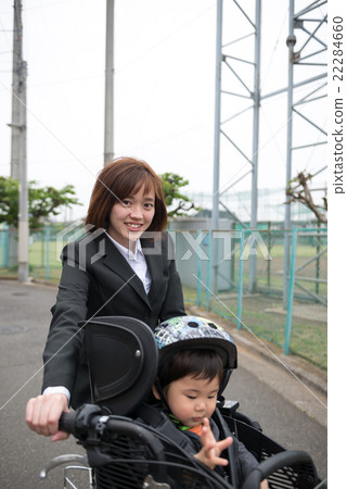Taking a child on a bicycle Taking a child on a bicycle 22284660