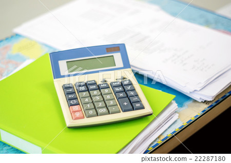 Calculator on a desk, soft focus. 22287180