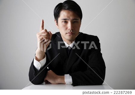 Men in business suits hanging their forefingers 22287269