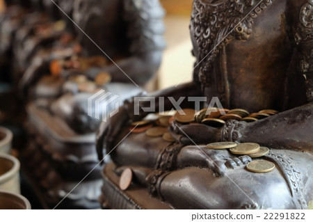 Angel statue with put the coins by donors 22291822